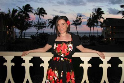 DD in her Hwaiian Dress on the Lanai of the Islander Resort Quest Resort on Kauai. The red flower dress with black draping was beautiful in the wartm air filled with the Honeymoon romance of the Hawaiian Island of Kauai
